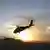 Helikopter militer AS, Black Hawk, terbang menuju Marjah, Jumat sore (12/02) waktu Afghanistan.