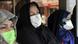 Ciudadanos iraníes se protegen del coronavirus con mascarillas. Ciudadanos iraníes se protegen del coronavirus con mascarillas.