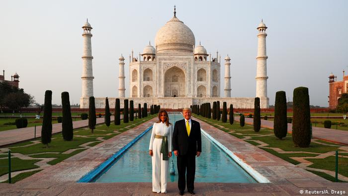 Melania and Donald Trump stand in front of the Taj Mahal