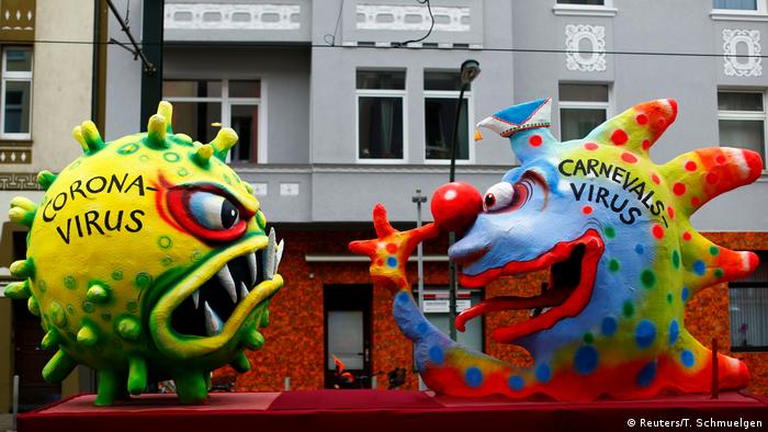 Figures depicting the coronavirus vs carneval virus are pictured during the Rosenmontag (Rose Monday) parade in Duesseldorf