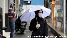 A pedestrian wears a mask and gloves to help guard against the Coronavirus, in downtown Tehran, Iran, Tuesday, Feb. 25, 2020. The head of Iran's counter-coronavirus task force has tested positive for the virus himself, authorities announced Tuesday, showing the challenges facing the Islamic Republic amid concerns the outbreak may be far wider than officially acknowledged. The announcement comes as countries across the Mideast say they’ve had confirmed cases of the virus that link back to Iran, which for days denied having the virus. (AP Photo/Ebrahim Noroozi) |