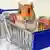 A cartoon hamster sits in a grocery cart