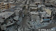 TOPSHOT - An aerial view taken on December 8, 2019 shows the damage caused by reported Syrian regime and Russian air strikes the previous day in the town of Al-Bara in the south of Syria's Idlib province, that killed at least four civilans, including a child and wounding several others. - The reported air raids killed 19 civilians, eight of them children, in the country's last major opposition bastion. (Photo by Omar HAJ KADOUR / AFP)