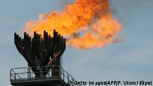 Picture dated on April 14, 2009 shows gas flaring at the Total oil platform at Amenem, 35 kilometers away from Port Harcourt in the Niger Delta. Amenem is the hub of Total oil production with two oil well producing over 100,000 barrels of crude daily. AFP PHOTO / PIUS UTOMI EKPEI (Photo credit should read PIUS UTOMI EKPEI/AFP via Getty Images)