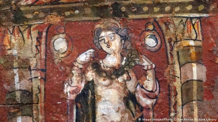 Aphrodite in a shrine adorning herself with a necklace (Imago Images/Photo12/Ann Ronan Picture Library)