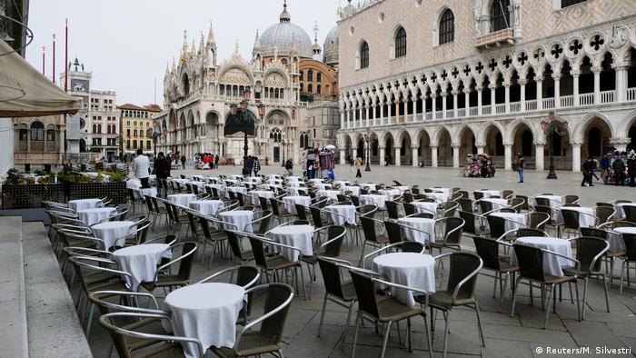  Empty tables are pictured outside a restaurant at St Mark's Square in Venice