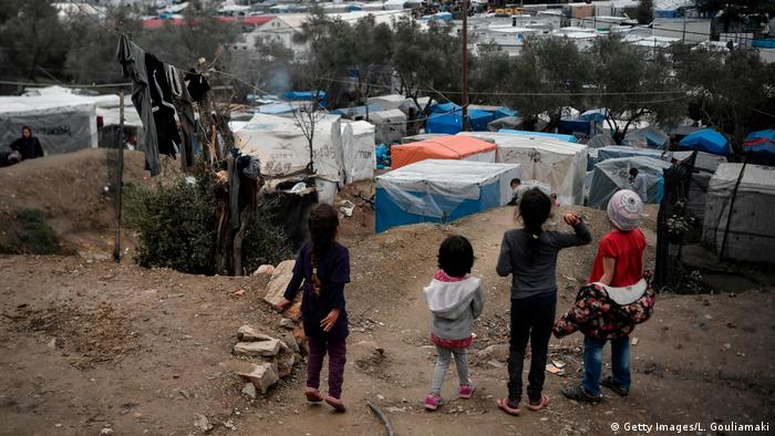 Children play at the overcrowded Moria migrant camp on the Greek Aegean island of Lesbos