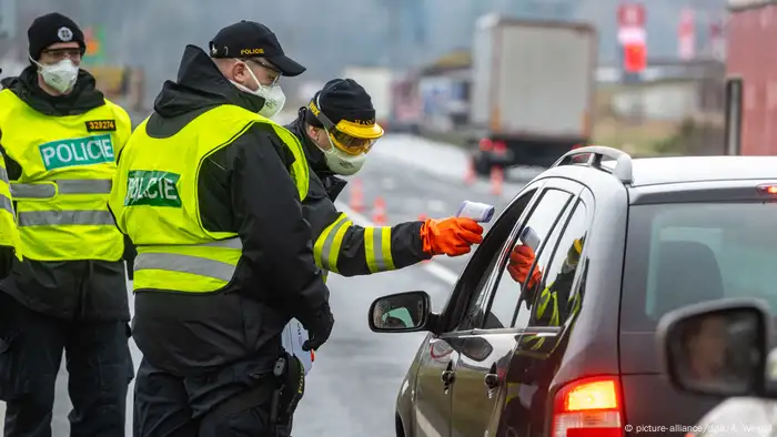 Border authorities check the temperature of a traveler in the Czech Republic