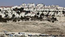 FILE -- In this Jan. 22, 2017 file photo, the Israeli settlement of Maaleh Adumim looms over Arab Bedouin shacks in the West Bank, Sunday, Jan. 22, 2017. Yaakov Katz, a prominent West Bank settler, said Sunday, March 26, 2017, that the number of Israelis living in the West Bank has soared by nearly one quarter over the past five years to over 420,000 people. Katz says the rapid growth means the internationally backed idea of a two-state solution between Israel and the Palestinians is now impossible. (AP Photo/Mahmoud Illean, File) |
