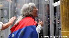 10.03.2020++++++++++ CARACAS, VENEZUELA - MARCH 10: An anti-Maduro demonstrator shouts to Venezuelan National Police officers during a demonstration against the government of NicolÃ¡s Maduro organized by supporters of Juan Guaido on March 10, 2020 in Caracas, Venezuela. This demonstration is the first massive event called by Juan GuaidÃ› after his international tour which included a meeting with Donald Trump in Washington. (Photo by Edilzon Gamez/Getty Images)