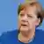 German Chancellor Merkel addresses a news conference on coronavirus in Berlin