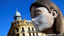 A ninot, a gigantic structure made of cardboard portraying current events, wearing a protective mask is displayed in Valencia on March 11, 2020 after the Fallas festival was cancelled over the coronavirus outbreak - Coronavirus infections in Spain have passed the 2,000 mark with 47 deaths, the health ministry announced, making it Europe's second most severe outbreak after Italy. (Photo by JOSE JORDAN / AFP) (Photo by JOSE JORDAN/AFP via Getty Images)
