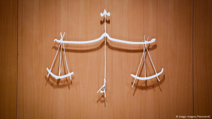 The scales of justice on a wall in a Paris court The scales of justice on a wall in a Paris court