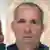 Passbild von dem Verdächtigen, der unter dem Namen Michael Bodenheimer in Dubai eingereist ist (Foto:dpa)