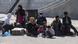 Asylum seekers wait before Greek Navy's transportation ship named "Rhodes" depart with 450 asylum seekers Asylum seekers wait before Greek Navy's transportation ship named "Rhodes" depart with 450 asylum seekers