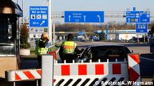 German police officers check a car at the Swiss-German border after Germany announced border controls, as the country faces an aggressive progression of the coronavirus disease (COVID-19), in Weil am Rhein, Germany, March 16, 2020. REUTERS/Arnd Wiegmann