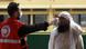 A worker checks a man's temperature following an outbreak of the coronavirus disease A worker checks a man's temperature following an outbreak of the coronavirus disease