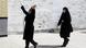 Two Iranian women in black during a funeral from the coronavirus outbreak Two Iranian women in black during a funeral from the coronavirus outbreak