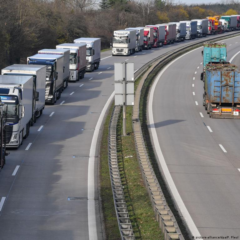 16 March 2020, Brandenburg, Frankfurt (Oder): Trucks are piling up on  Autobahn 12 in front of the German-Polish border crossing. Poland has  closed its borders to all foreigners since Sunday morning because