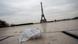 A face mask is seen on the ground near the Eiffel Tower in Paris, France A face mask is seen on the ground near the Eiffel Tower in Paris, France