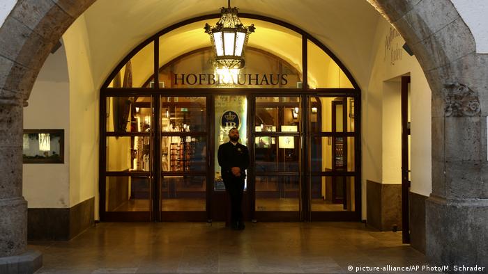 Germany - Doorman outside the closed doors of the Hofbräuhaus in Munich