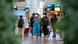 South African airport interior, people wear masks South African airport interior, people wear masks