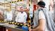 A cashier behind a protective shield at a hardware store in Germany A cashier behind a protective shield at a hardware store in Germany