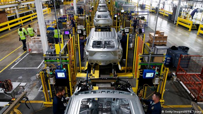 Workers assemble cars at the newly renovated Ford's Assembly Plant in Chicago
