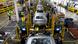 Workers assemble cars at the newly renovated Ford's Assembly Plant in Chicago Workers assemble cars at the newly renovated Ford's Assembly Plant in Chicago