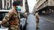 Italian soldiers wearing protective masks work at a roadblock Italian soldiers wearing protective masks work at a roadblock