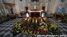 Coffins wait to be transported to cemetery, in the church of Serina, near Bergamo, Northern Italy, Saturday, March 21, 2020. Italy’s tally of coronavirus cases and deaths keeps rising, with new day-to-day highs: 793 dead and 6,557 new cases. For most people, the new coronavirus causes only mild or moderate symptoms. For some it can cause more severe illness. (Claudio Furlan/LaPresse via AP) |