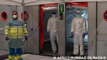 This handout picture made available by Madrid´s regional government, Comunidad de Madrid, shows a health worker preparing for the arrival of patients at the temporary hospital set up for coronavirus patients at a pavilion in Ifema convention and exhibition center in Madrid, on March 21, 2020. - Spain announced 394 new deaths caused by the novel coronavirus, raising to 1,720 the official death toll in Europe's worst-hit country after Italy, a 30 percent increase over the previous day. (Photo by - / COMUNIDAD DE MADRID / AFP) / RESTRICTED TO EDITORIAL USE - MANDATORY CREDIT AFP PHOTO / HANDOUT / COMUNIDAD DE MADRID - NO MARKETING - NO ADVERTISING CAMPAIGNS - DISTRIBUTED AS A SERVICE TO CLIENTS