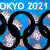 The five Olympic rings logo in front of a sign saying Tokyo 2021