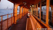 A commuter enjoys the sunset alone on the upper deck of a Staten Island Ferry during the outbreak of the coronavirus disease (COVID-19) in Manhattan, New York City, U.S., March 26, 2020. REUTERS/Caitlin Ochs TPX IMAGES OF THE DAY