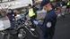 Members of the police work at a checkpoint to verify the work permits of citizens Members of the police work at a checkpoint to verify the work permits of citizens