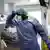 A doctor in protective clothing at a French intensive care unit