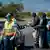 Police man a checkpoint in Cape Town erected as part of coronavirus measures