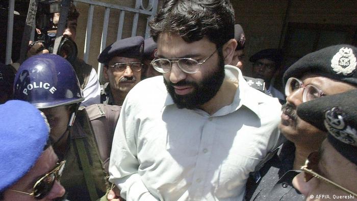 Ahmed Omar Saeed Sheikh is escorted by security personnel
