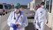A doctor and a medical student prepare to help patients in Tübingen A doctor and a medical student prepare to help patients in Tübingen