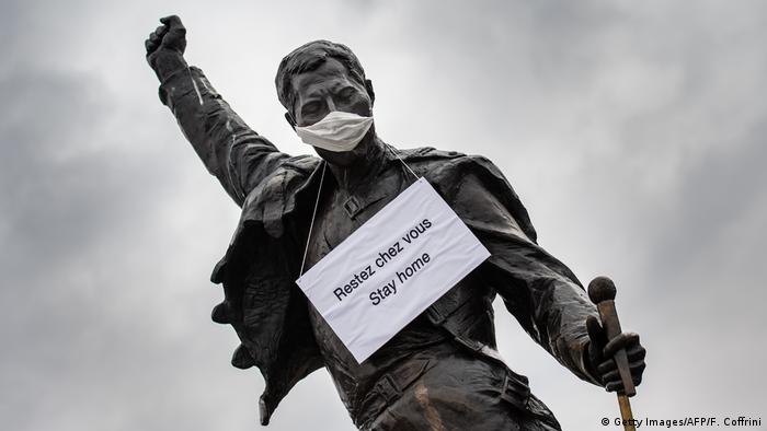 The statue in Montreux of Queen's late singer Freddie Mercury wearing a protective mask