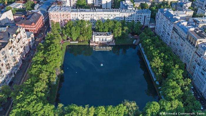 The Patriarch Ponds surrounded by trees and high-rise buildings