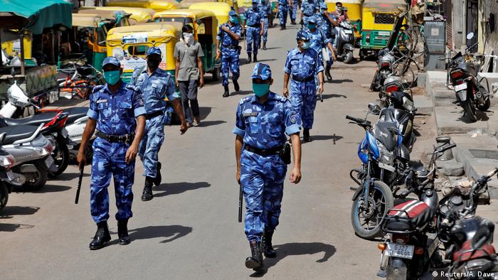 Members of a rapid action force in Ahmedabad, India patrol a neighborhood (Reuters/A. Dave)