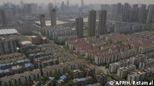 A general view shows buildings in Wuhan, in China's central Hubei province on April 7, 2020. - Wuhan, the central Chinese city where the coronavirus first emerged last year, partly reopened on March 28 after more than two months of near total isolation for its population of 11 million. (Photo by Hector RETAMAL / AFP)