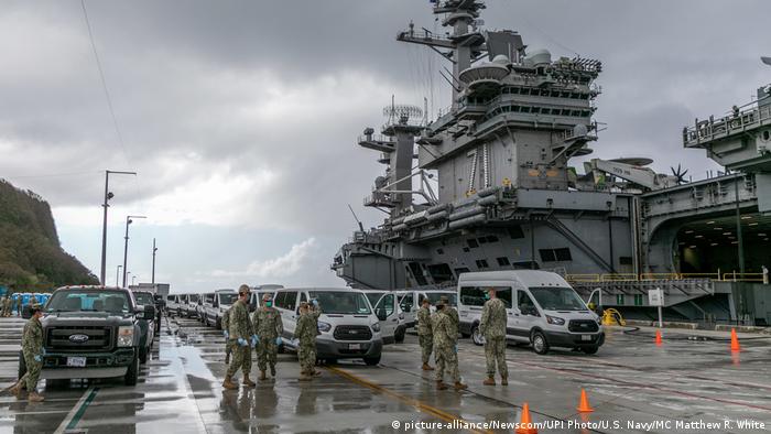 Sailors aboard the aircraft carrier USS Theodore Roosevelt