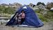 Kids stand in a tent on the island of Lesbos Kids stand in a tent on the island of Lesbos