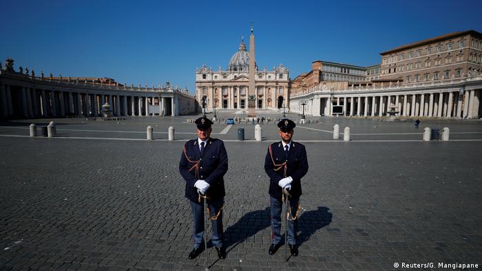 Police officers stand in St. Peter's Square, as Pope Francis holds his Easter Sunday