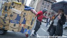 A deliveryman from Lasership travels through the Chelsea neighborhood of New York on Thursday, February 22, 2018 with his cart laden with purchases from the likes of Amazon, Blue Apron, Walmart and others. (ÂÂ Richard B. Levine) |