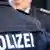 Policeman's back with 'Polizei' written on it