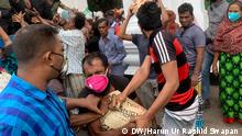 People ignoring social distance rules in Dhaka, Bangladesh during relief distribution to the poor people. Copyright: Harun Ur Rashid Swapan 