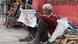 A man in Delhi reads newsppaer amid COVID-19 lockdown A man in Delhi reads newsppaer amid COVID-19 lockdown